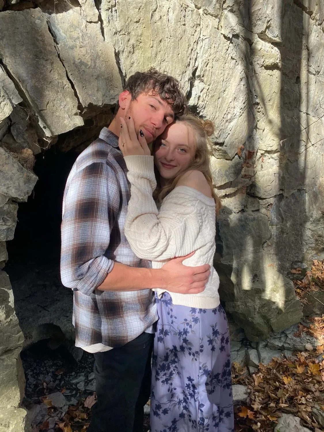 Nathan and Piper embracing outdoors