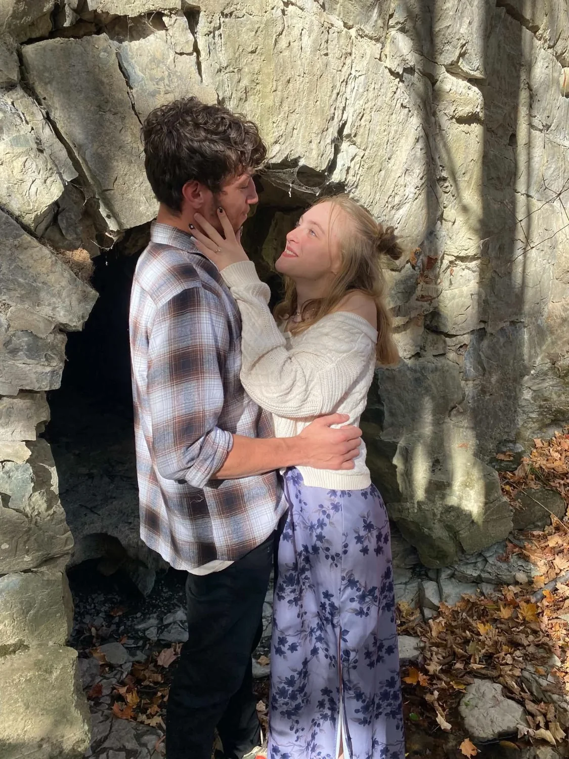 Nathan and Piper looking at each other outdoors